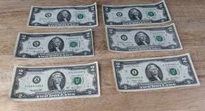 lot 19 image: (6) Six US $2 Bills (2)-1976 (2)-2003 (1)-2013 (1)-2009  K
