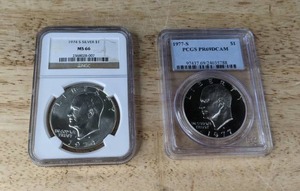 lot 53 image: Eisenhower Coins MS 66 1974 S Silver Dollar and 1977 S PCGS PR69DCAM Silver Dollar K