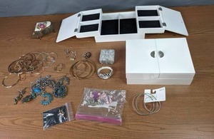 lot 254 image: Assortment of Costume Jewelry, Earrings, Necklaces, Watch, Piano Trinket Box, Jewelry Storage Boxes and More M