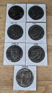 lot 143 image: Seven Eisenhower Liberty Dollar Coins K