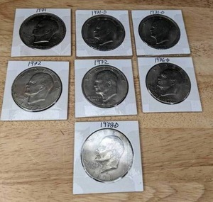 lot 142 image: Seven Eisenhower Liberty Dollar Coins K