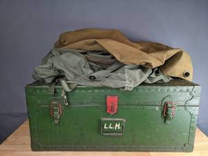 lot 725 image: Vintage Green Metal Trunk, National Guard Digital Camo Bucket Hat, Green Duffle Bags, Etc. M