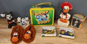 lot 708 image: Vintage Disney Collection Cast Iron Mickey Bank, 3 Little Pigs Toothbrush Holder, Sport Goofy Lunchbox, Christmas Ornaments, and More  M