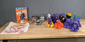 lot 736 image: NFL Moss 84, Cunningham 7, Carter 80, Elway 7, McGwire 25, Sosa 21, Favre 4 Beanie Babies, General Mills Adrian Peterson Wheaties Box, Dallas Cowboys Mini Helmets, 2002 Twins Homer Hanky Souvenir, Etc. M