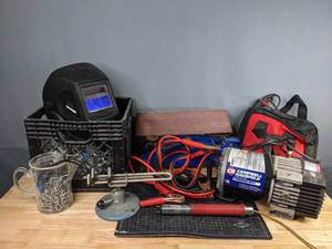 lot 182 image: Miscellaneous Garage Items Bauer 12 VSR Hammer Drill, Portable Air Compressor, Schumacher Automatic Battery Maintainer, Hopkins 4 Flat Set Connector, Chicago Electric Welding Helmet, and More R