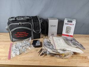 lot 195 image: Smartcode Electronic Deadbolt, Jensen Cassette Player, Zero Gravity Perfectio, Box of Emu Feathers, Lunchbox with Dinnerware and More  R