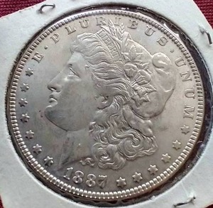 lot 104 image: 1887 Morgan Dollar