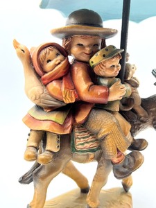 lot 665 image: Anri Figurine Riding Through the Rain