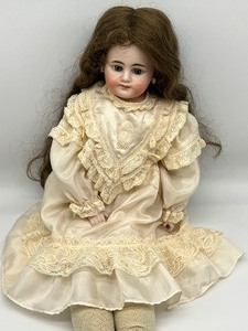 lot 789 image: Antique Doll with Leather Body