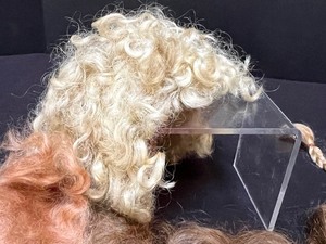 lot 838 image: Four Doll Wigs