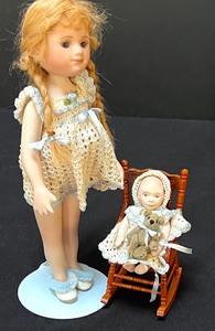 lot 811 image: Two Small Porcelain Dolls