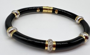 lot 709A image: Black Enamel and 18k Diamond Bangle Bracelet by SOHO