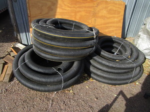 lot 124 image: (3) Rolls of 4 Drain Tile Pipe