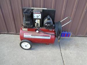 Sanborn 110 volt 2 hp 22 gal air comprssor. Tested & works. But has pin hole on bottom of tank. For parts & repair. As shown.