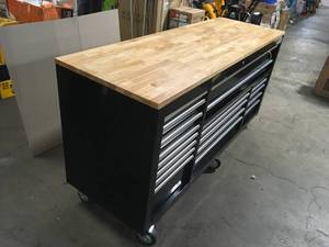 lot 29 image: Husky 72 in. x 24.1 in. D 20-Drawer Mobile Workbench with Adjustable Height Solid Wood Top in Gloss Black customer return review pictures