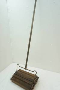 antique Bissell floor sweeper
