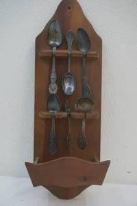 display rack with silver spoons