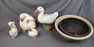 A Collection of Plastic Planters and Ceramic and Stone Birds