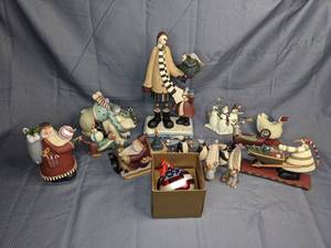A Collection of Winter Figurines and a Flag Painted Ornament Including Snowmen, People and Santa Figurines