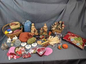 An Assortment of Multiple Holiday Decorations Including Valentines Decorations, Fall Decorations, Rabbit Figurines, Christmas Throw Pillow and More