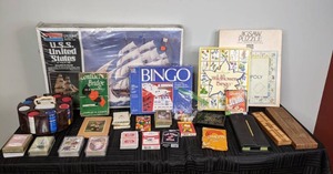 A Collection of Card Games, Bingo Sets, Poker Set, Cribbage Board, Monopoly Jigsaw Puzzle, U.S.S United States Ship Model Kit and More