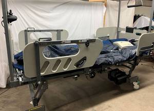 lot 16 image: MSRP $52,000 Hill-Rom Triflex 2 1000lb Capacity Bariatric Hospital Bed W4 Post Trapeze Set,&nbspImpulse Drive System (Tested Works),&nbspPlexus P2500 Low Air Loss & Alternating Pressure Mattress System (Works) & Hand Remote