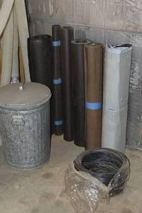 lot 308 image: UNDERLAYMENT, A TIN TRASH BIN, AND WIRE