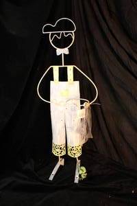 lot 123 image: Metal Decorative Plant Stand - Boy in Overalls