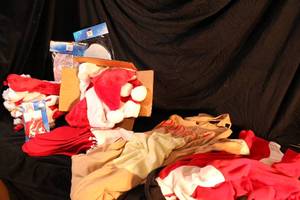 lot 189 image: Hosting Christmas Lot Santa Hats, Stockings, Santa and Rudolph Onesie (Adult)