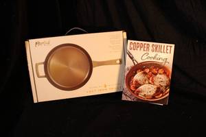 lot 2 image: NEW Parini Cast Iron Skillet and Copper Skillet Cookbook
