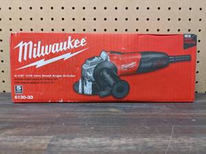 lot 47 image: Milwaukee 7 Amp Corded 4-12 in. Small Angle Grinder with Sliding Lock-On Switch