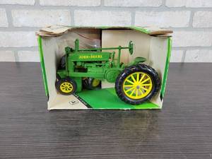 lot 1242 image: ERTL 1934 John Deere Model A Tractor w Spoke Wheels and Solid Wheels - 116 Scale