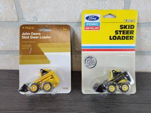 lot 1285 image: ERTL John Deere 675 Skid Steer - 164 Scale & ERTL New Holland 555 Skid Steer - 164 Scale