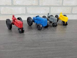 lot 1317 image: (4) Scale Models Museum Plastic Tractors, 1987, 1988, 1989, 1990 - All Autographed by Joseph L. Ertl - Each is Approx. 5 Long