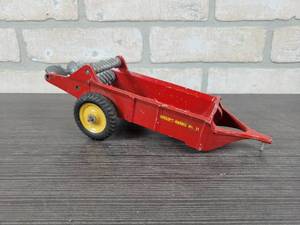lot 1318 image: AUBURN Cast Aluminum Massey Harris No. 11 Spreader Toy - Approx. 10 Long