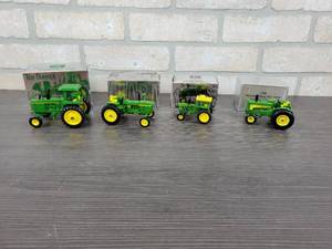 lot 1331 image: (4) National Farm Toy Show John Deere Tractors - 4230 Diesel - 143 Scale, 4010 Diesel - 143 Scale, 4520 Diesel - 164 Scale and Model 630 - 143 Scale