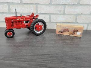 lot 1336 image: Farmall M Diecast Tractor - 116 Scale and ERTL Historical Toy Set - 164 Scale