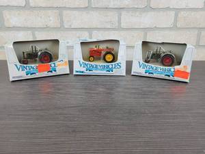 lot 1337 image: ERTL Vintage Vehicles Series Tractors - (2) Massey Harris Challengers and Massey Harris 44 - All are 143 Scale