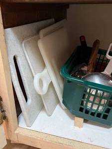 lot 48 image: Contents of Cabinet Baking Dishes, Cutting Boards, Vintage Flour Sifter & More
