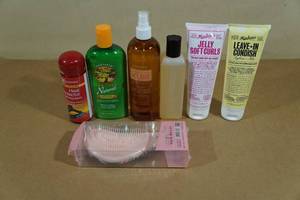 lot 51 image: Assorted Hair Products -Heat Protector, Mousse, Biotene, Brush