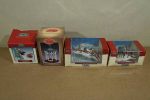 lot 93 image: 4 Lemax Vail Village Collection Figurines -Sledding, Skiing, Gazebo