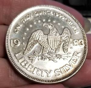 lot 52 image: 1 TROY OZ .999 FINE SILVER 1983 AMARK LIBERTY ROUND