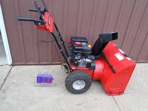 lot 104 image: MTD 26 snowblower 208cc Briggs engine with electric start. Appears to be in good condition. As Shown. THIS ITEM HAS A RESERVE.