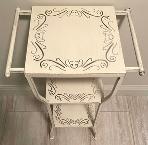 lot 51 image: Cream 3 Tier Metal Table with Cut Out Shelves