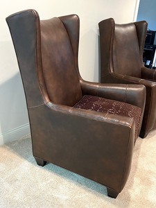 lot 5 image: Pair of Leather High Back Chairs with Upholstered Seats by Arhaus