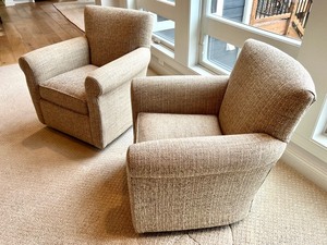 lot 23A image: Pair of Swiveling Neutral Colored Upholstered Chairs by Arhaus