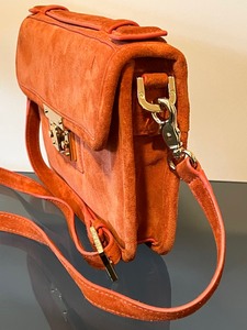 lot 76 image: Orange Suede Tori Burch Handbag