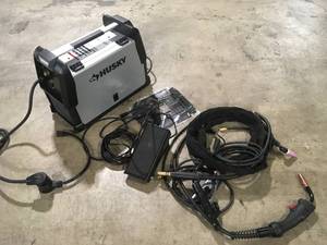 Husky  Single Phase 180 Amp 240-Volt120-Volt AC Wire Feed 180 MIG Wire Feed Welder with Foot Pedal and Dual Voltage Technology open box customer return