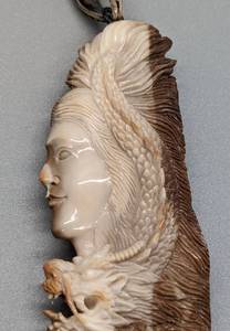 Figural Intricately Carved Bone Pendant