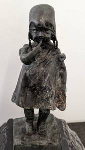 Bronze Child Sculpture on Stone